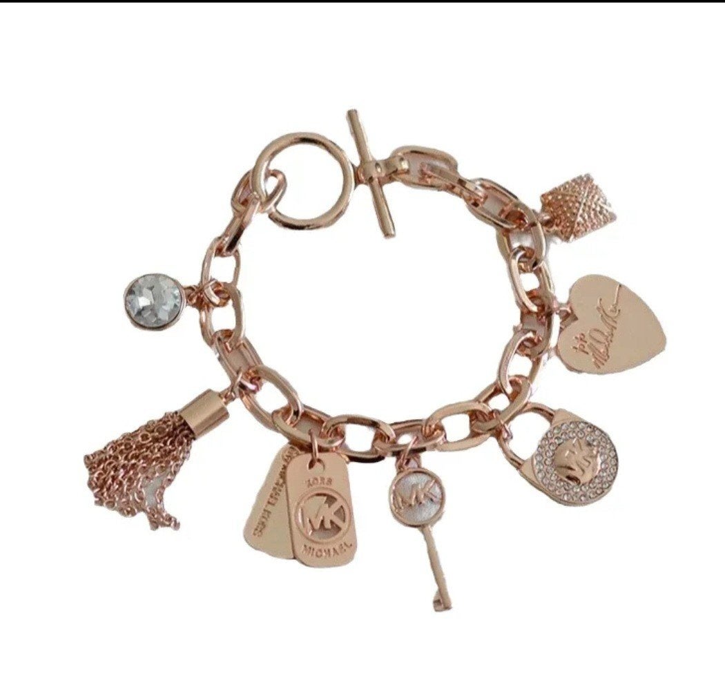 Michael Kors bedelarmband - goud, Overige materialen, Met bedels of kralen, Nieuw, Ophalen of Verzenden