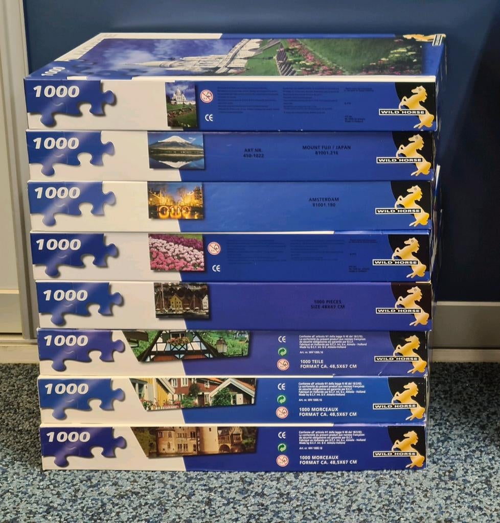 8 blauwe dozen Wildhorse legpuzzels, elk met 1000 stukjes., Ophalen of Verzenden, 500 t/m 1500 stukjes, Gebruikt, Legpuzzel