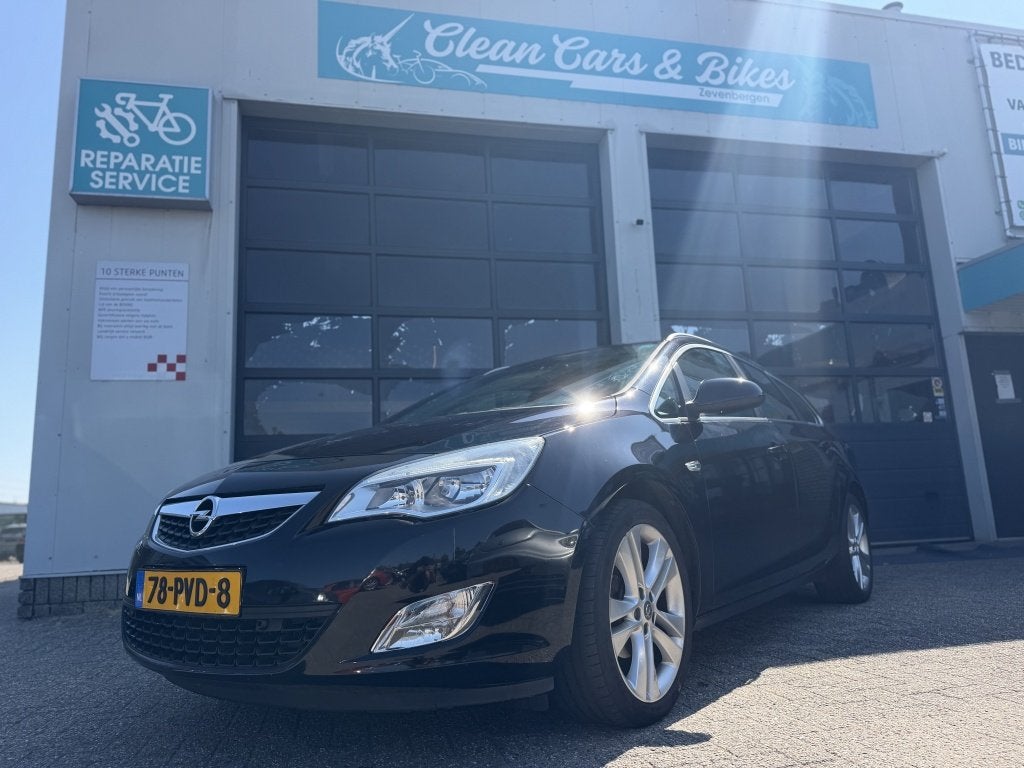 Opel Astra Sports Tourer 1.4 Turbo Cosmo (bj 2011), Auto's, Gebruikt, 4 cilinders, 1337 kg, Zwart