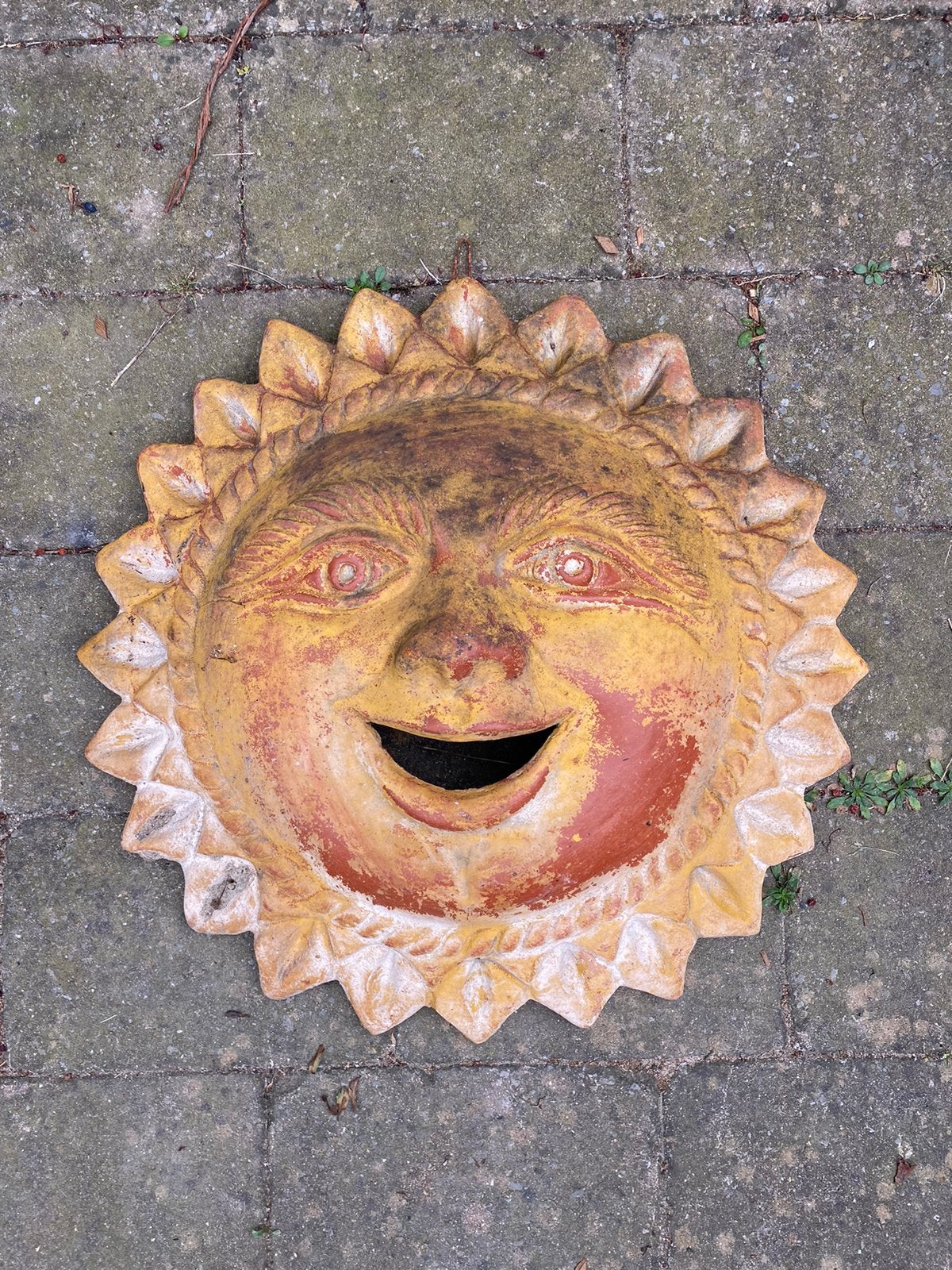 Keramische zon wanddecoratie, Ophalen