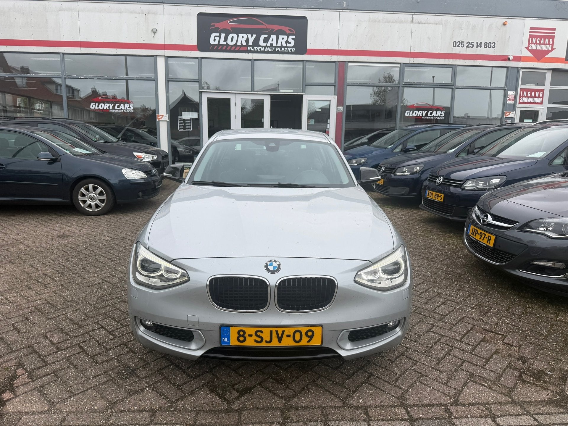 BMW 1-serie 116i Business AUTOMAAT-NAVI-CRUISE-PDC, Auto's, Euro 5, Gebruikt, Zwart, 4 cilinders
