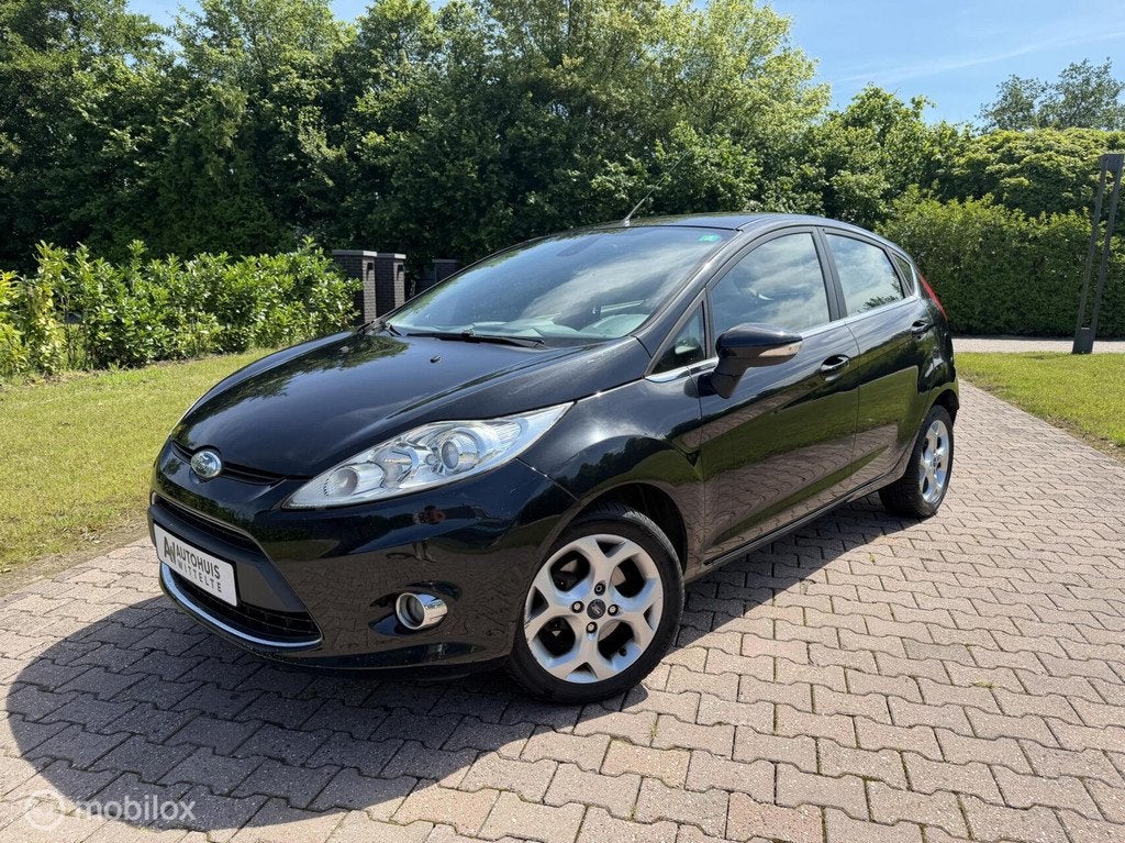 Ford Fiesta 1.25 Titanium, Clima Boordcomputer, Lichtmetaal, Auto's, Voorwielaandrijving, 1242 cc, 82 pk, Zwart