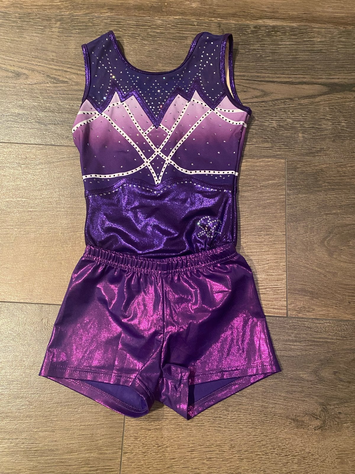Sparkle & Dream Turnpakje Puck Paars met broekje 134-140, Ophalen of Verzenden, Zo goed als nieuw, Meisje, Sport- of Zwemkleding