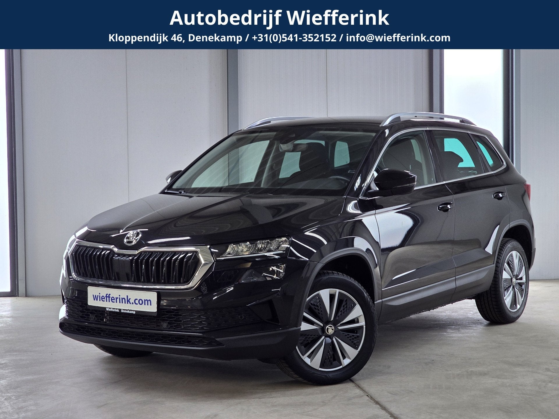 Skoda Karoq 1.5 TSI ACT Business Edition Plus DSG | Navi | A, Auto's, 12 maanden, Stof, 4 cilinders, Zwart
