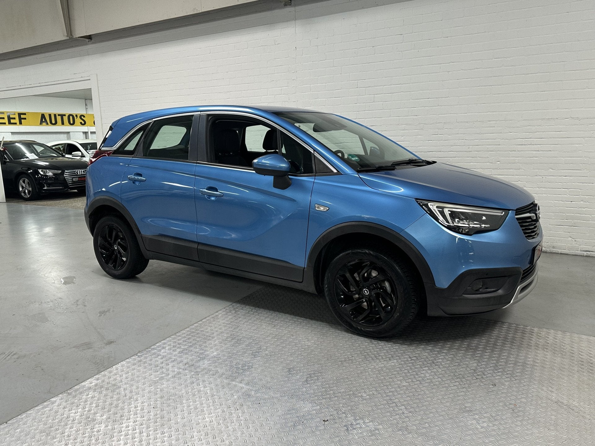 Opel Crossland X 1.2 Turbo Innovation CLIMA // CRUISE // NAV, Auto's, Gebruikt, Blauw, Leder en Stof, Bedrijf