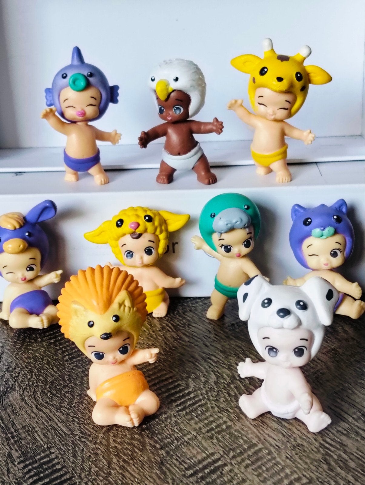 Leuke Twozies baby poppetjes met dierenhoed- 9 stuks, Ophalen of Verzenden, Zo goed als nieuw