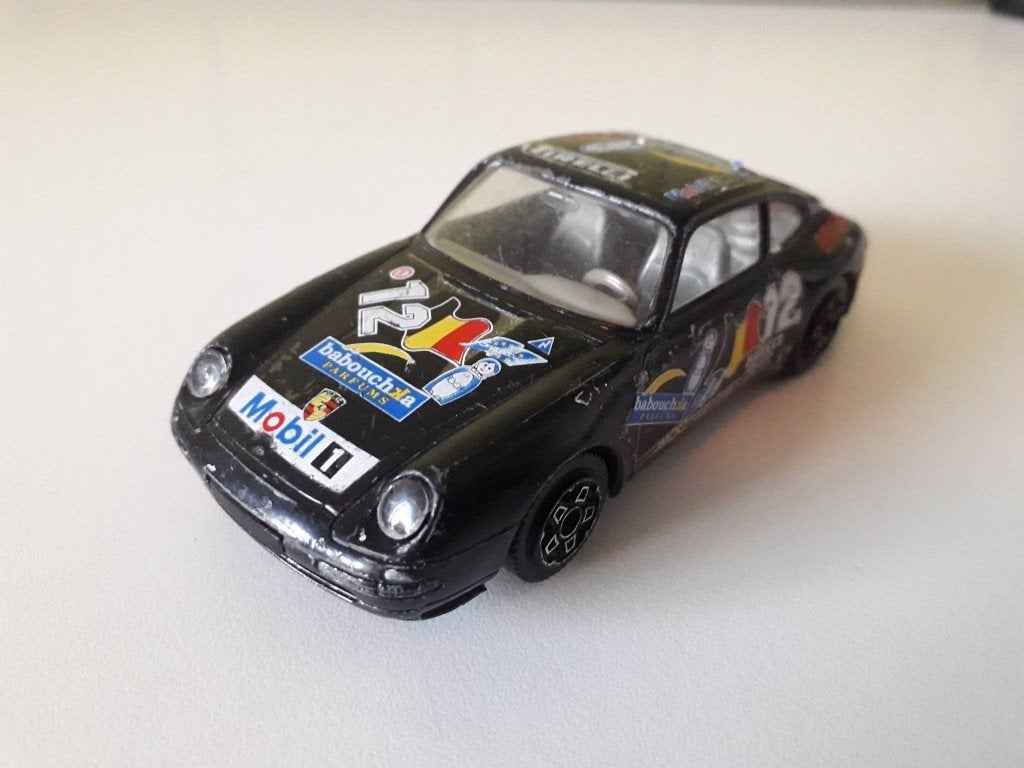 porsche 911 carrera              burago, Hobby en Vrije tijd, Modelauto's | 1:43, Ophalen of Verzenden, Gebruikt, Auto, Overige merken