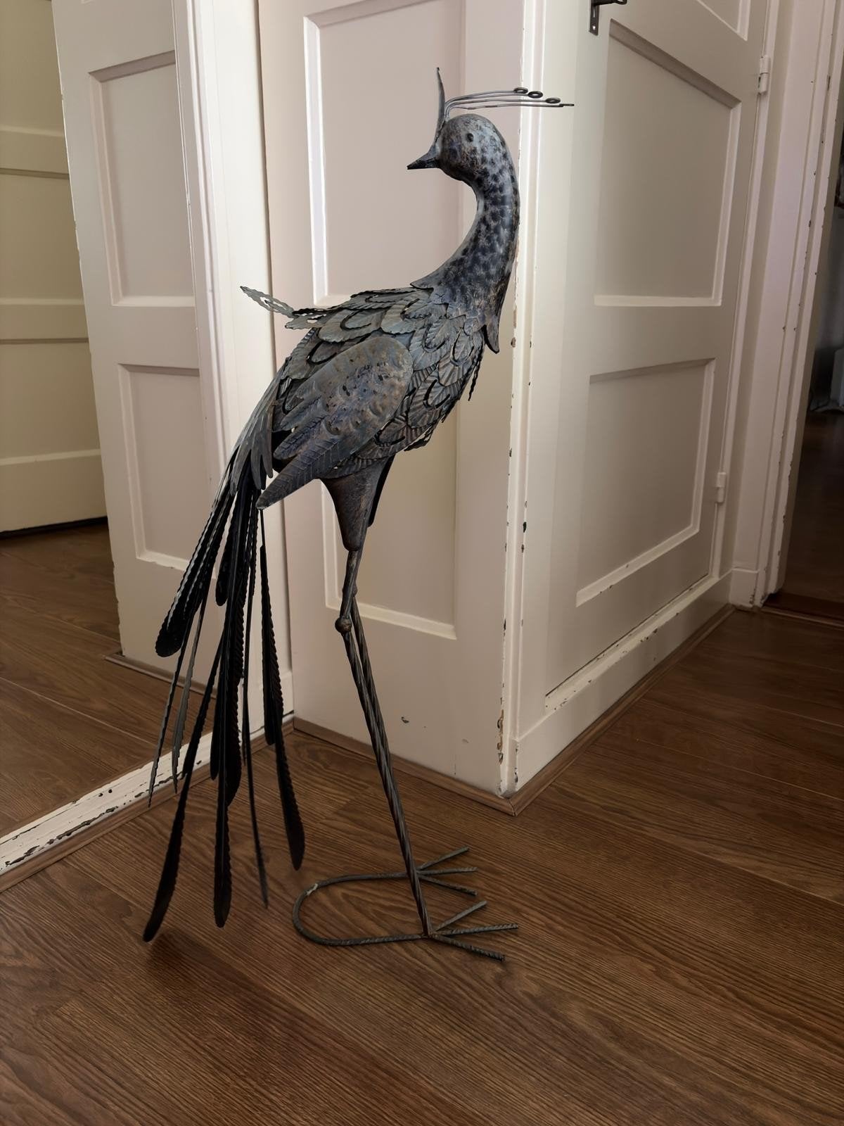 Grote metalen pauw, Ophalen