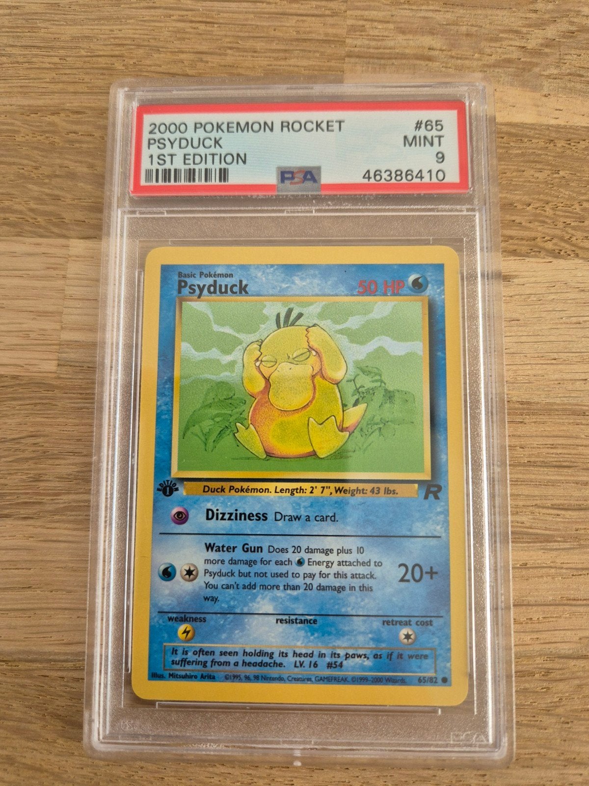 PSA 9 MINT 2000 Pokemon Rocket Psyduck 1st Edition #65, Ophalen of Verzenden, Zo goed als nieuw, Losse kaart