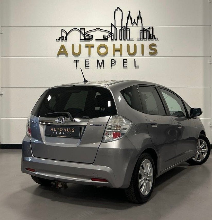Honda Jazz 1.4 Hybrid Exclusive Automaat Nap 1E Eigenaar Dea, Auto's, Euro 5, Gebruikt, Zwart, 4 cilinders