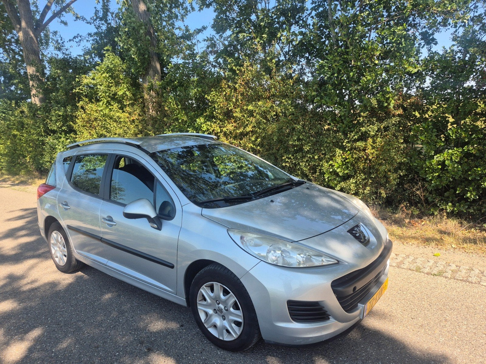 Peugeot 207 1.4 95pk 2010 Grijs, Auto's, Voorwielaandrijving, Stof, Origineel Nederlands, Stationwagon