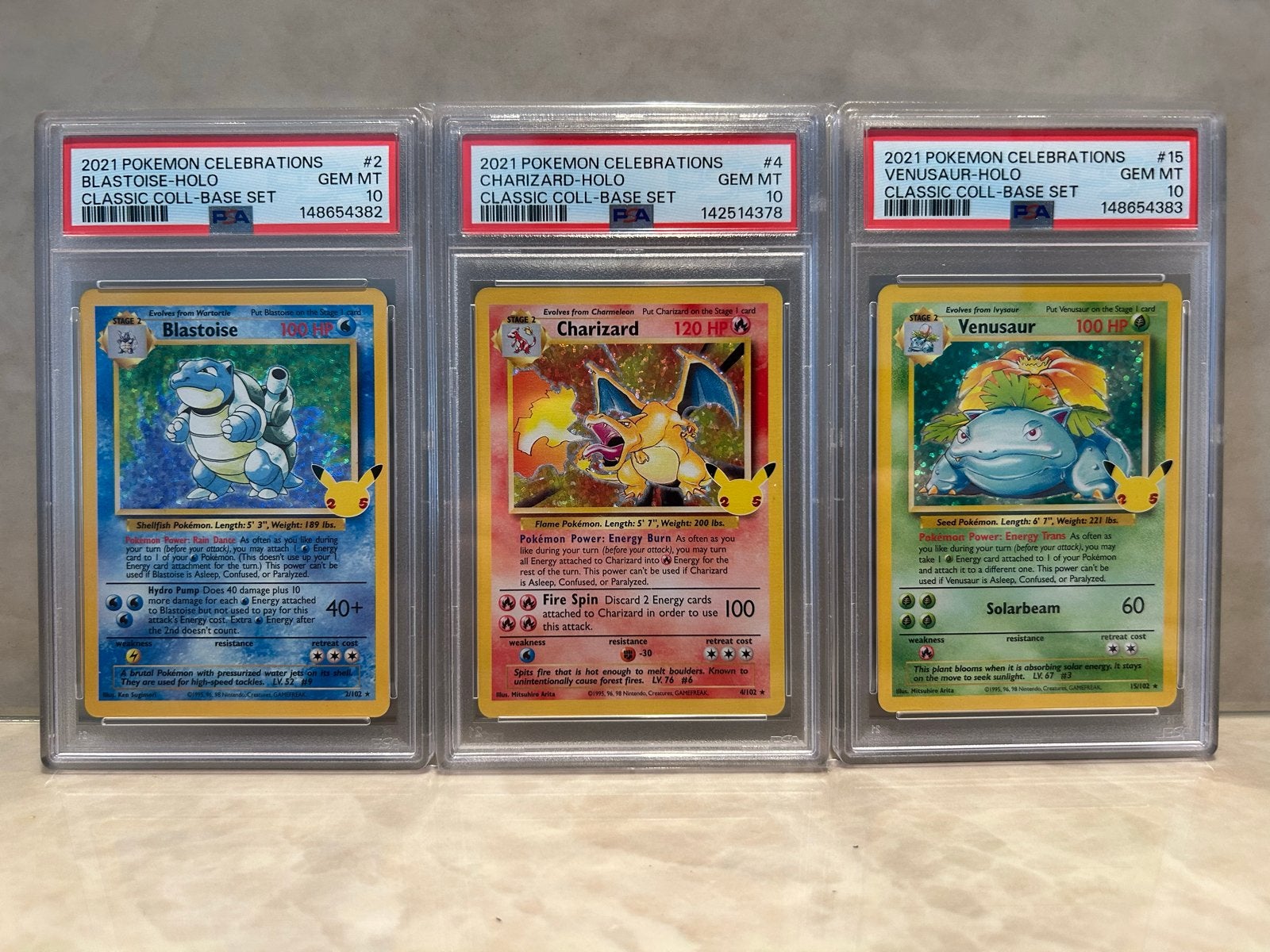 Pokémon Celebrations PSA 10 Charizard 4 Blastoise 2 Venusaur, Ophalen of Verzenden, Nieuw, Meerdere kaarten, Foil