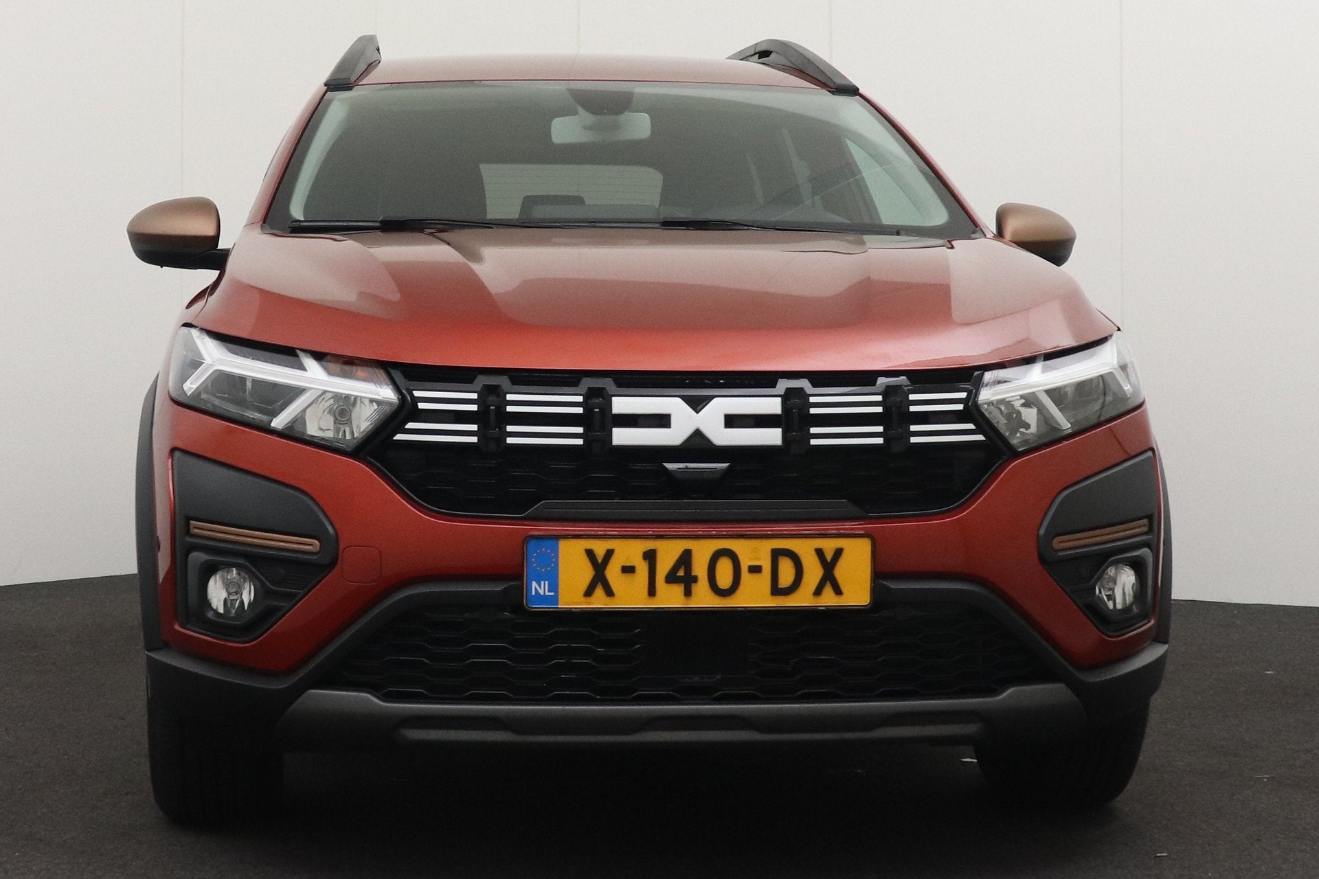 Dacia Jogger 1.6 Hybrid 140 Extreme 7p. Trekhaak Afn.Camera, Auto's, Dealer onderhouden, 4 cilinders, Bruin, 7 stoelen