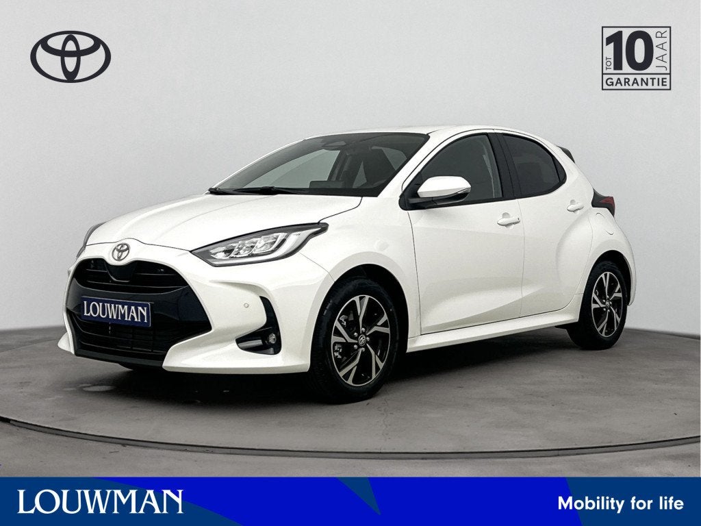 Toyota Yaris 1.5 Hybrid 115 Dynamic Comfort Pack Nu te BESTE, Auto's, 12 maanden, Stof, Zwart, 116 pk