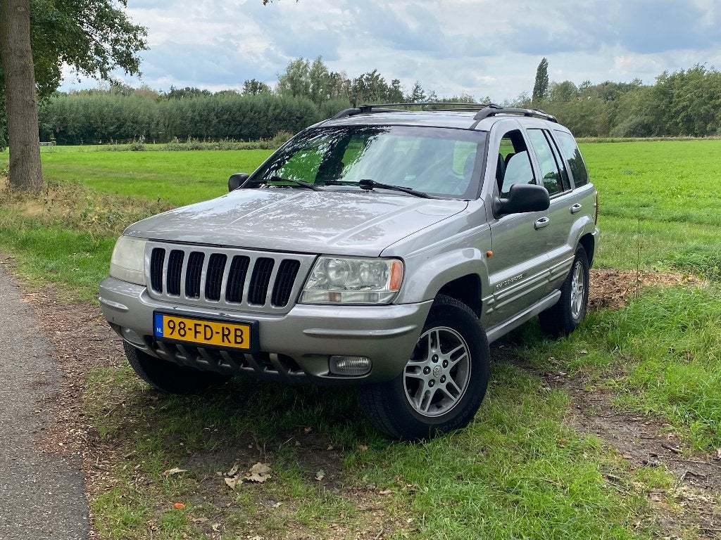 Jeep Grand Cherokee 4.7 I V8 Limited AUT 2000 Grijs, Auto's, Automaat, 3360 kg, Leder en Stof, Origineel Nederlands