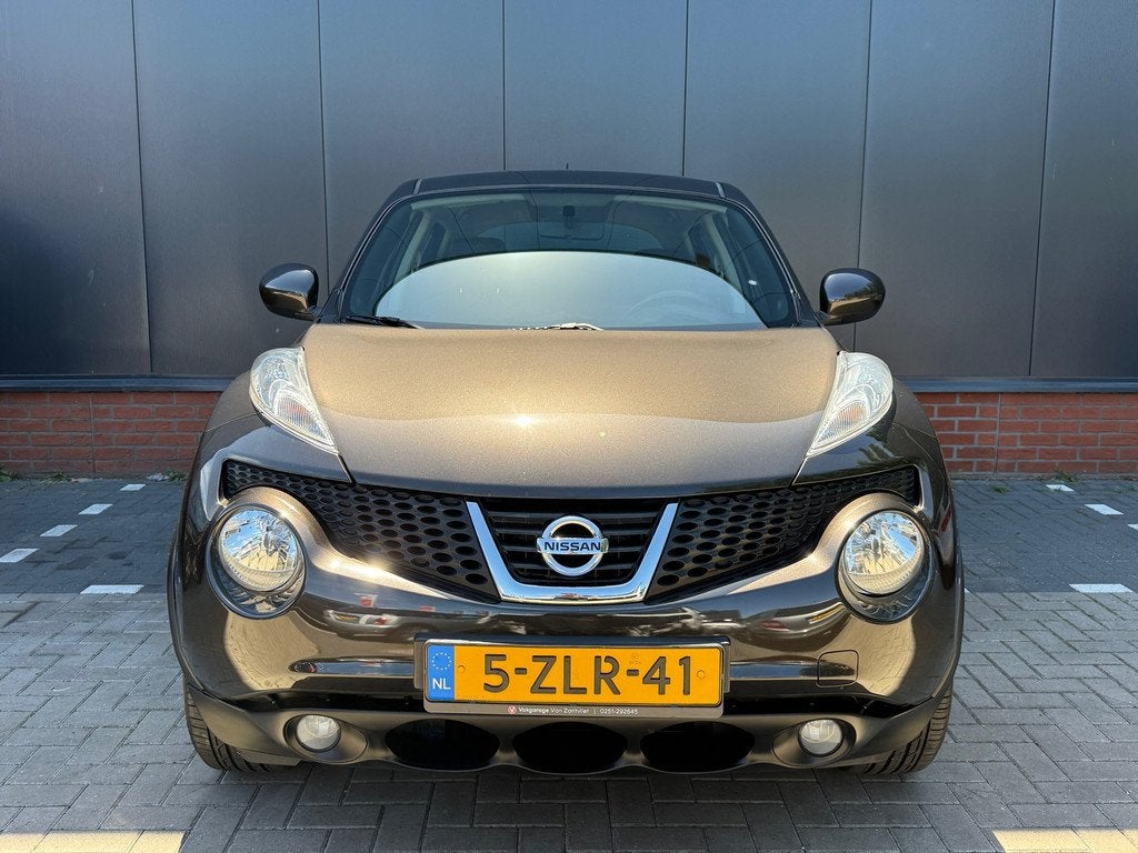 Nissan Juke Tekna 1.6 (12 mnd BOVAG-garantie), Auto's, Nissan, Parkeersensor, Zwart, 4 cilinders, 49 €/maand