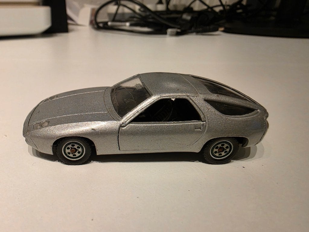 Porsche 928 1/43, Hobby en Vrije tijd, Ophalen of Verzenden, Gebruikt, Auto, Solido