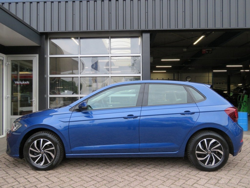 Volkswagen POLO 1.0 TSI LIFE BNS / Navi / Stoelverw. / Adap., Auto's, Gebruikt, Euro 6, Met garantie (alle), Blauw