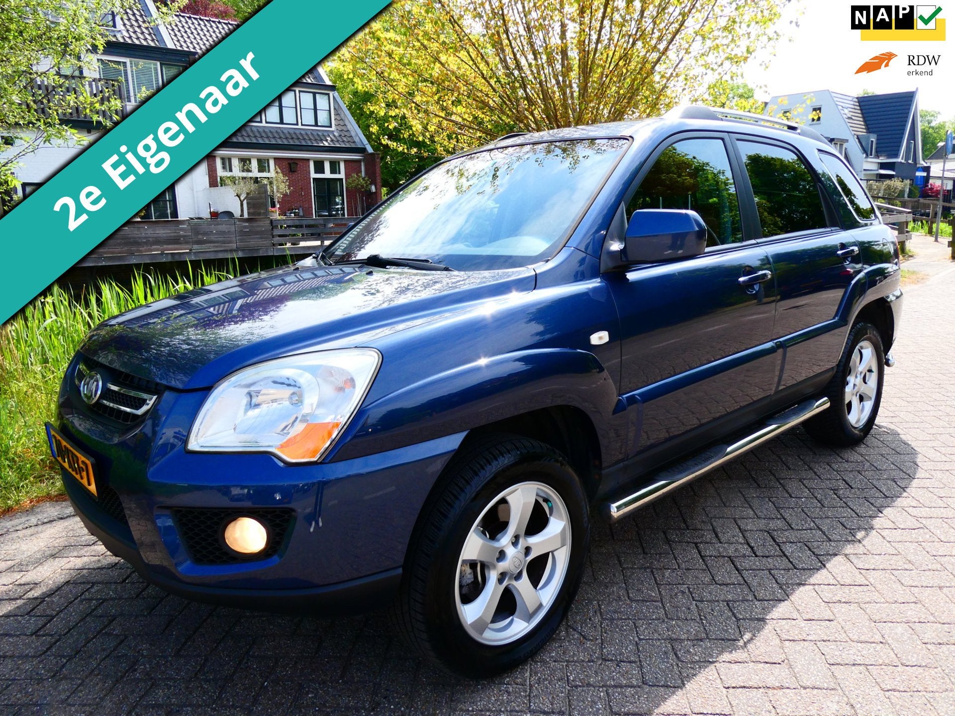 Kia Sportage 2.0 CVVT Fifteen 2e eig. Clima Cruise Kanteldak, Auto's, Kia, 1442 kg, Gebruikt, 4 cilinders, Blauw