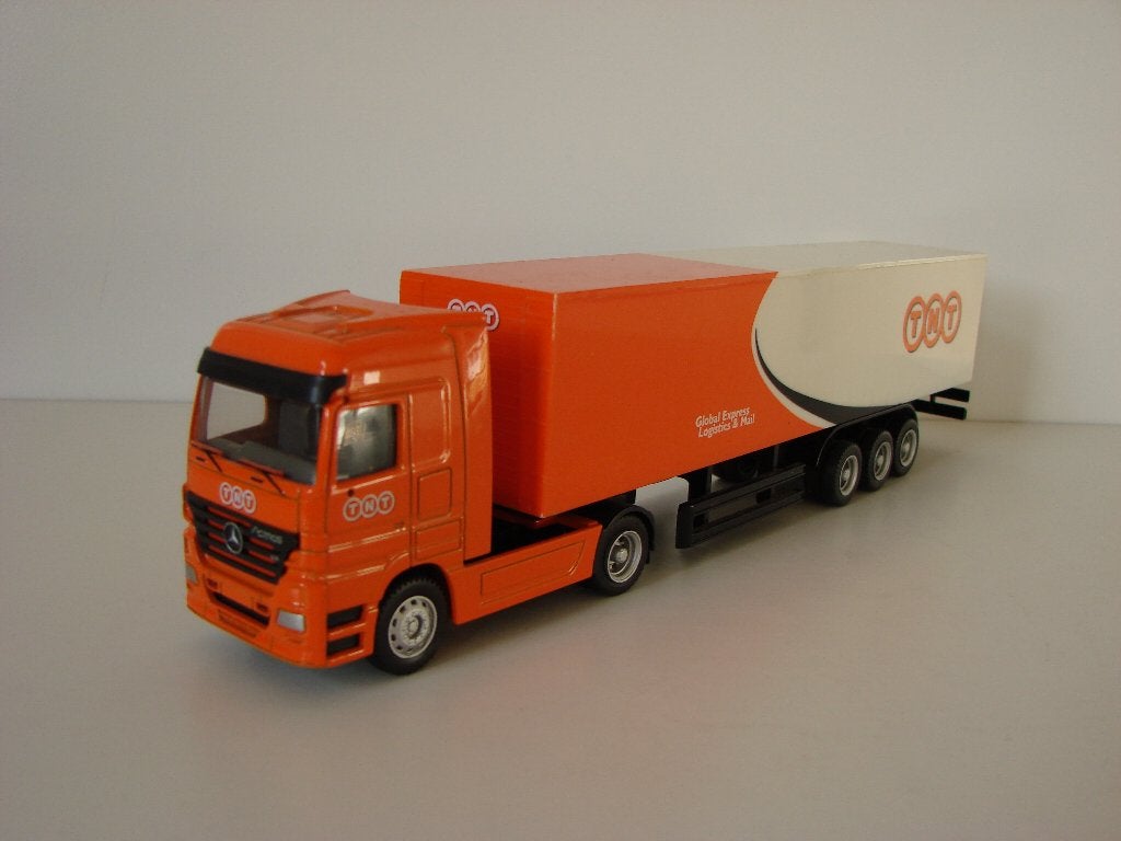 Mercedes-Benz Actros trekker oplegger TNT Global Express, Hobby en Vrije tijd, Modelauto's | Overige schalen, Ophalen of Verzenden