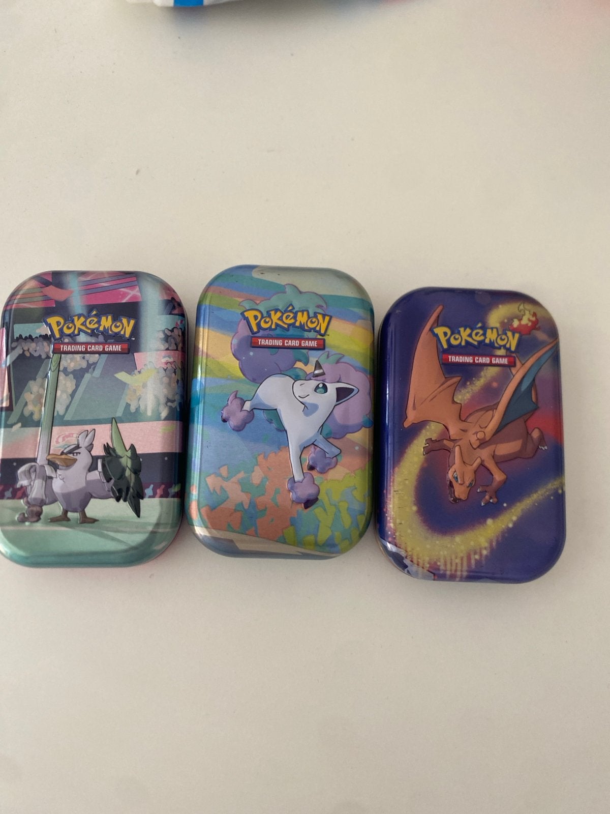 3 Pokémon blikken met kaarten en munten, Ophalen of Verzenden, Gebruikt, Meerdere kaarten, Foil