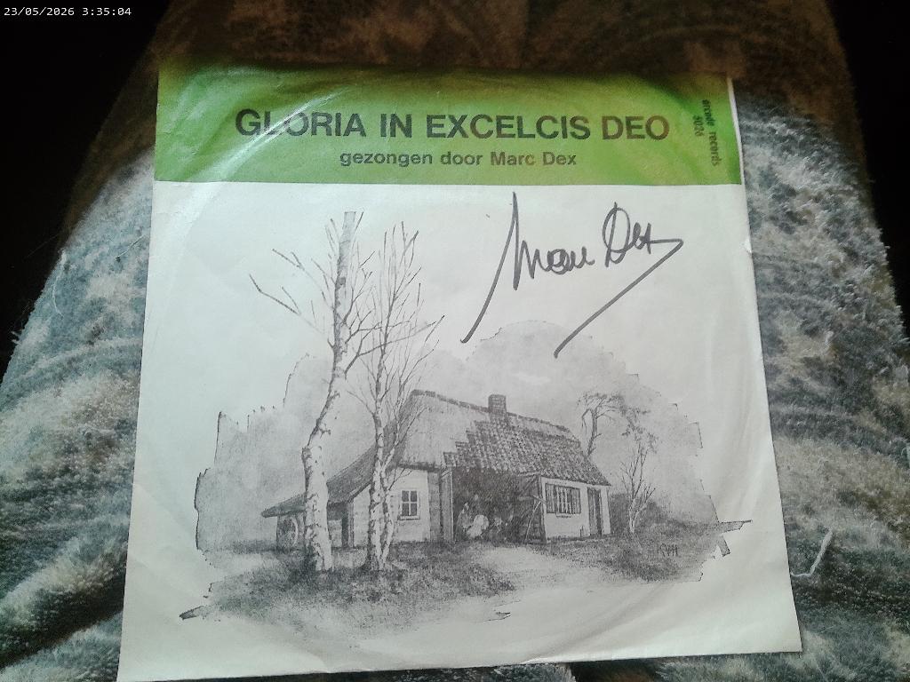 Marc Dex - Gloria in exelcis Deo, Fotohoes, Ophalen of Verzenden, Gebruikt, Nederlandstalig