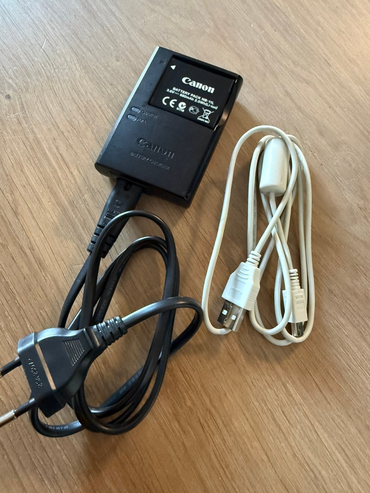 Canon oplader met batterij, Ophalen of Verzenden, Zo goed als nieuw