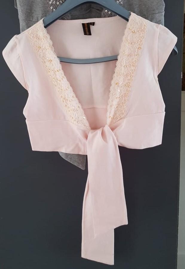 Wonder Woman bolero met kant en pailletjes mt. S, Wonder Woman, Verzenden, Zo goed als nieuw, Roze