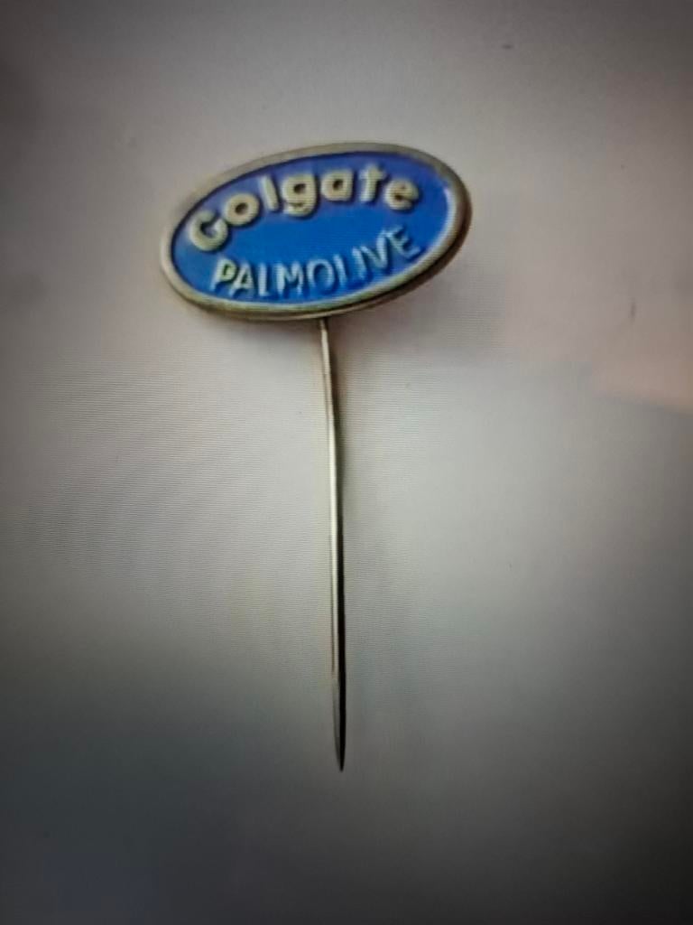 Speldje Colgate Palmolive, Ophalen of Verzenden, Zo goed als nieuw, Merk, Speldje of Pin