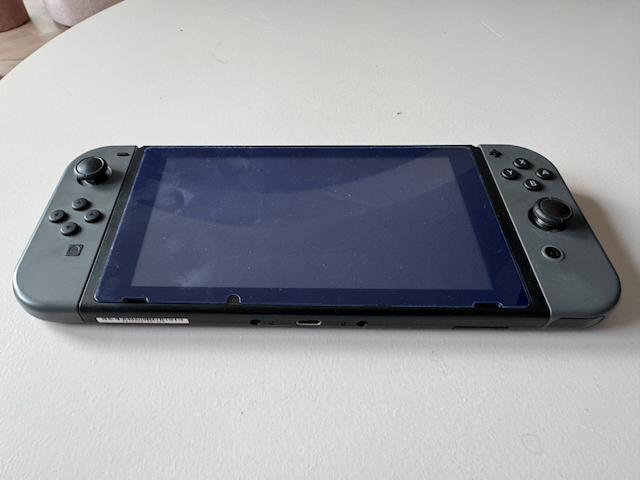 Nintendo Switch V1 UNPATCHED (XAJ4000) + accessoires, Spelcomputers en Games, Ophalen, Zo goed als nieuw, Met 2 controllers, Switch Original