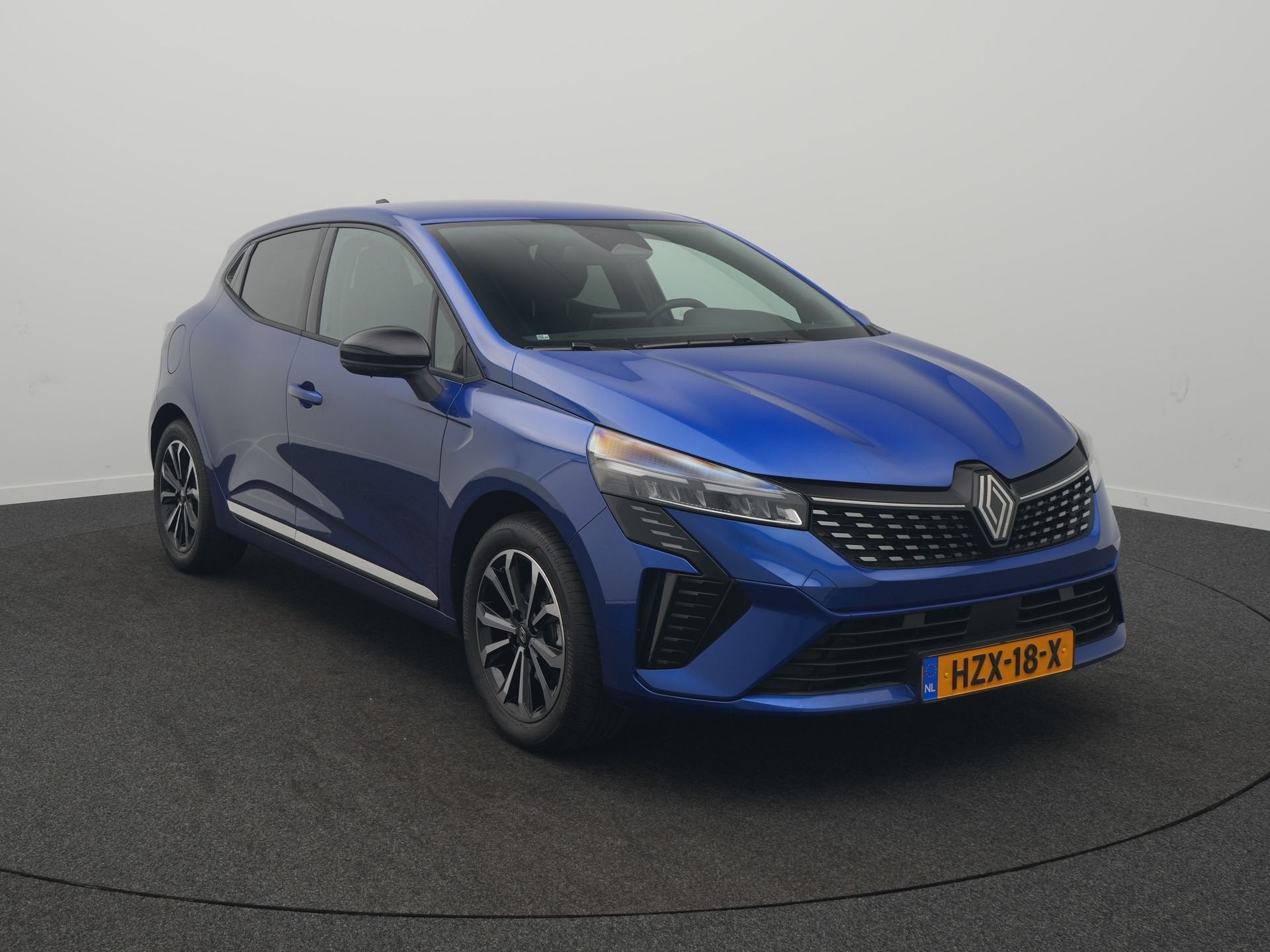 Renault Clio 1.6 E-Tech Full Hybrid 145 techno Pack Look - P, Auto's, Stof, Gebruikt, Blauw, Origineel Nederlands
