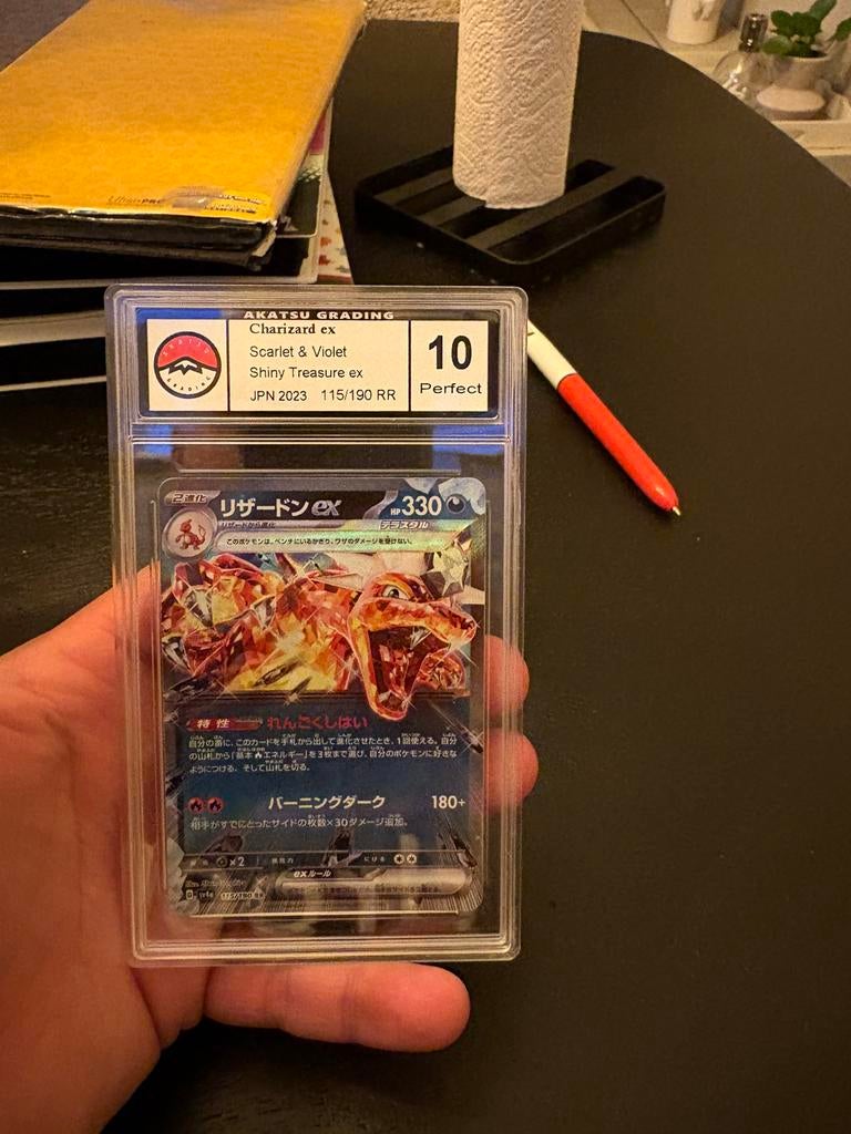 Charizard ex grade 10, Ophalen of Verzenden, Zo goed als nieuw, Meerdere kaarten, Foil