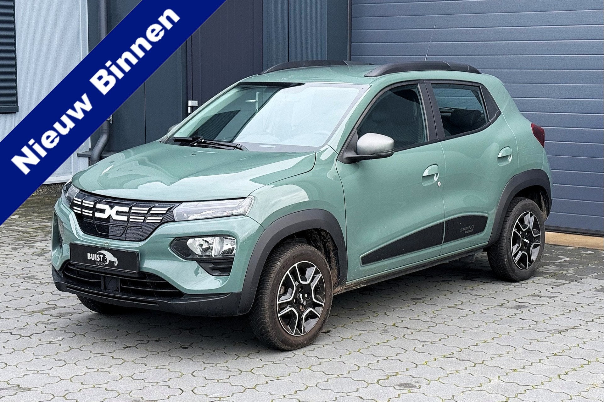 Dacia Spring Expression 27 kWh LEER CAMERA NAVI CARPLAY, Auto's, Dealer onderhouden, Gebruikt, Met garantie (alle), Parkeersensor