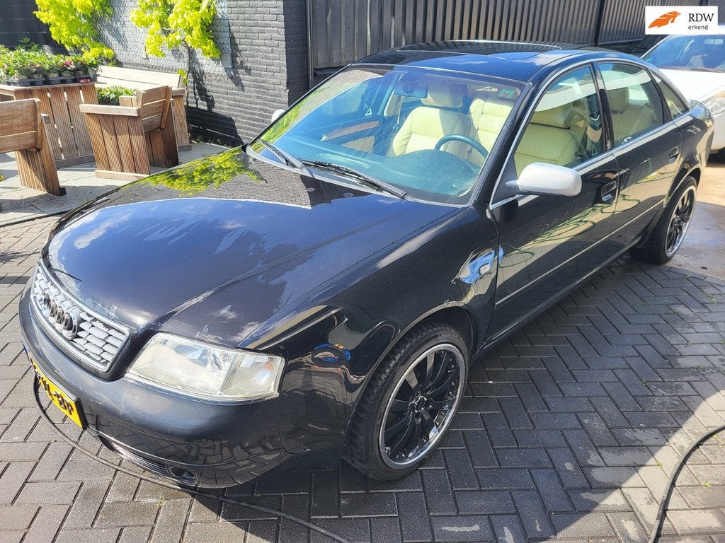 Audi A6 Limousine 2.4 5V quattro Advance autom sedan, Auto's, Oldtimers, Automaat, Automatische klimaatregeling, Beige, Zwart
