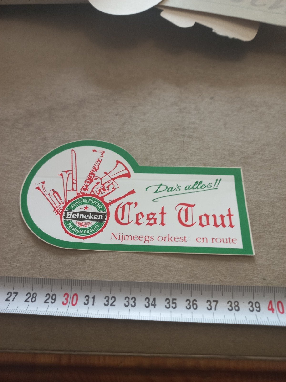 Heineken C'est Tout Nijmeegs Orkest Sticker, Ophalen of Verzenden, Gebruikt, Reclamebord