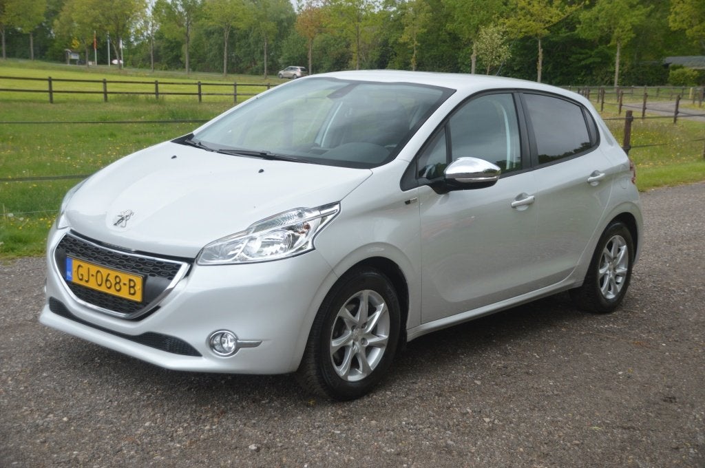 Peugeot 208 1.2 PT Style Pack Clima Cruise PDC Navi, Auto's, Voorwielaandrijving, Stof, Gebruikt, 82 pk