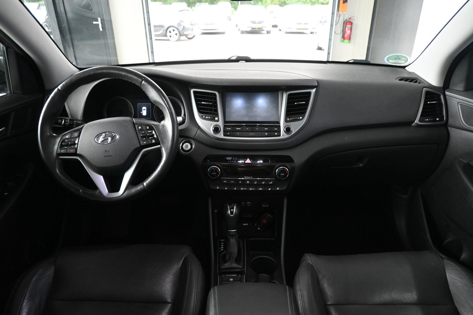 Hyundai Tucson 1.6 T-GDi Comfort 4WD Automaat Cruise Clima T, Gebruikt, 4 cilinders, Met garantie (alle), Leder
