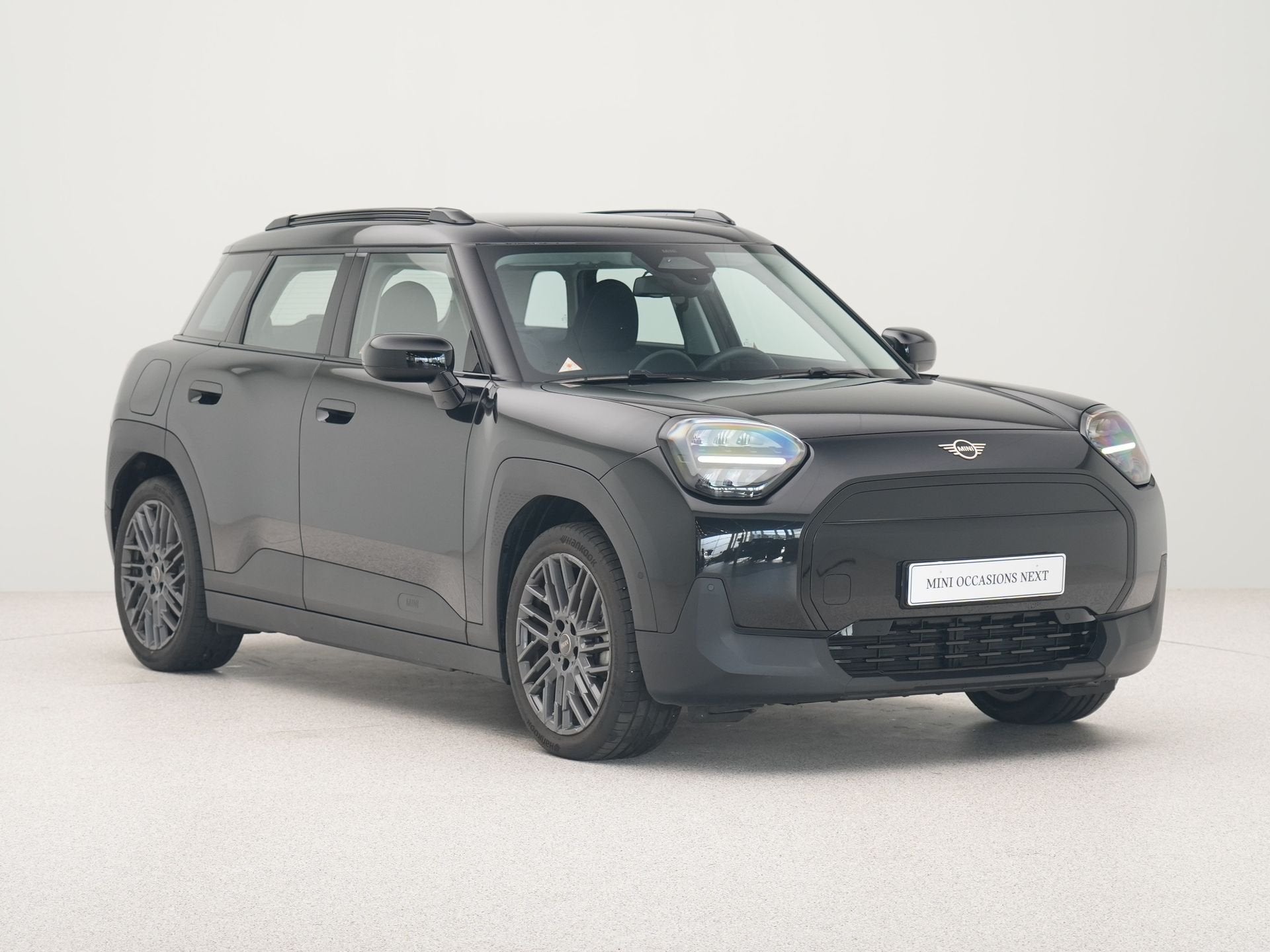 MINI Aceman E Essential (bj 2025, automaat), Auto's, Stof, Gebruikt, Met garantie (alle), Zwart