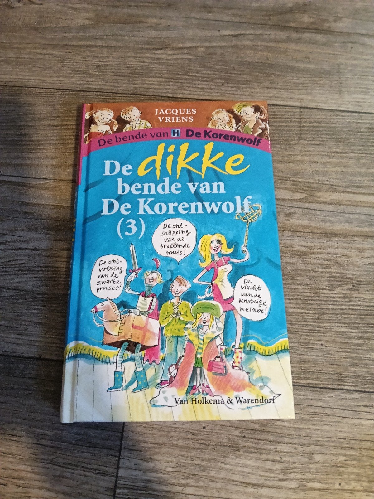 Boek; De dikke bende van de korenwolf., Verzenden, Zo goed als nieuw