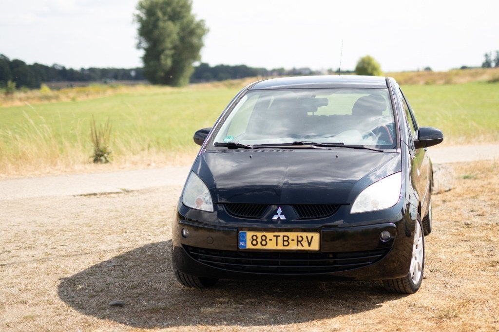 Mitsubishi Colt 1.3 Mivec CZ3 2006 Zwart, Auto's, Voorwielaandrijving, Stof, Origineel Nederlands, Overige kleuren