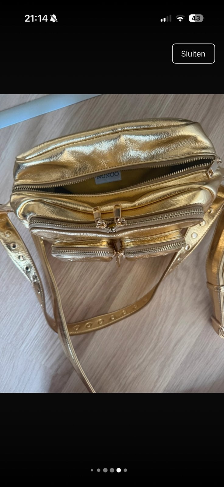 Gouden nùnoo tas, Ophalen, Zo goed als nieuw