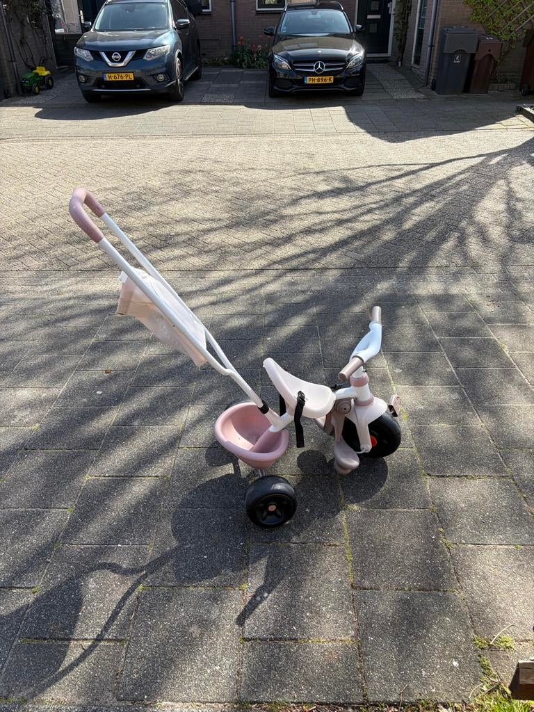 Roze driewieler met duwstang en verstelbare zitting, Ophalen of Verzenden, Gebruikt, Duwstang