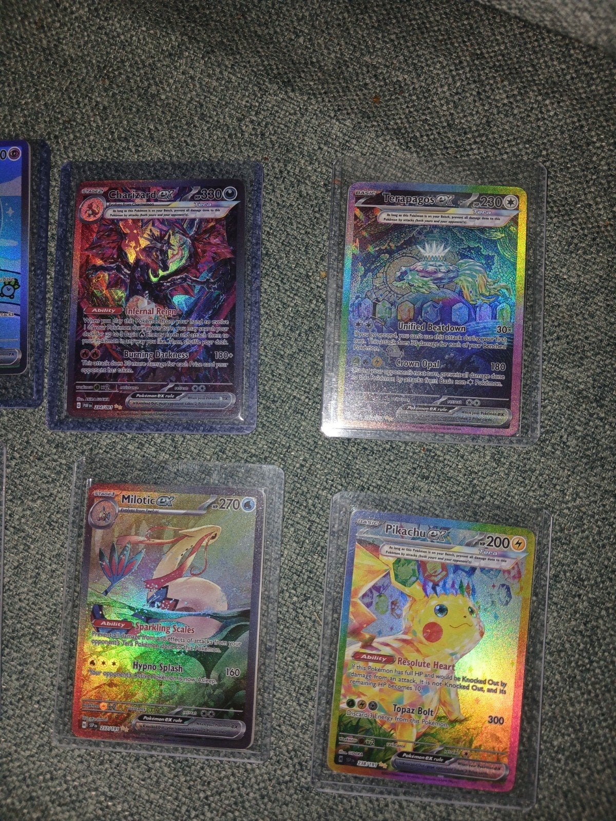 Pokémon kaarten: Charizard, Terapagos, Milotic, Pikachu, Ophalen of Verzenden, Zo goed als nieuw, Meerdere kaarten, Foil