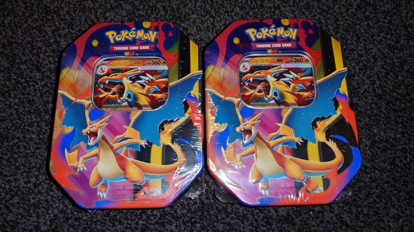 Pokémon TCG Charizard Y Tin (2 stuks), Ophalen of Verzenden, Nieuw, Boosterbox
