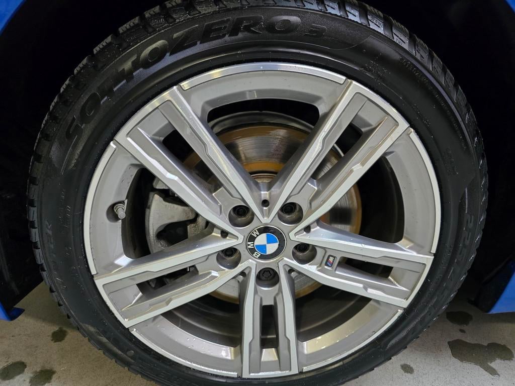 BMW 1-serie 118i High Executive Edition M-Sport Pano Leder N, Auto's, BMW, Gebruikt, Blauw, 3 cilinders, 695 kg
