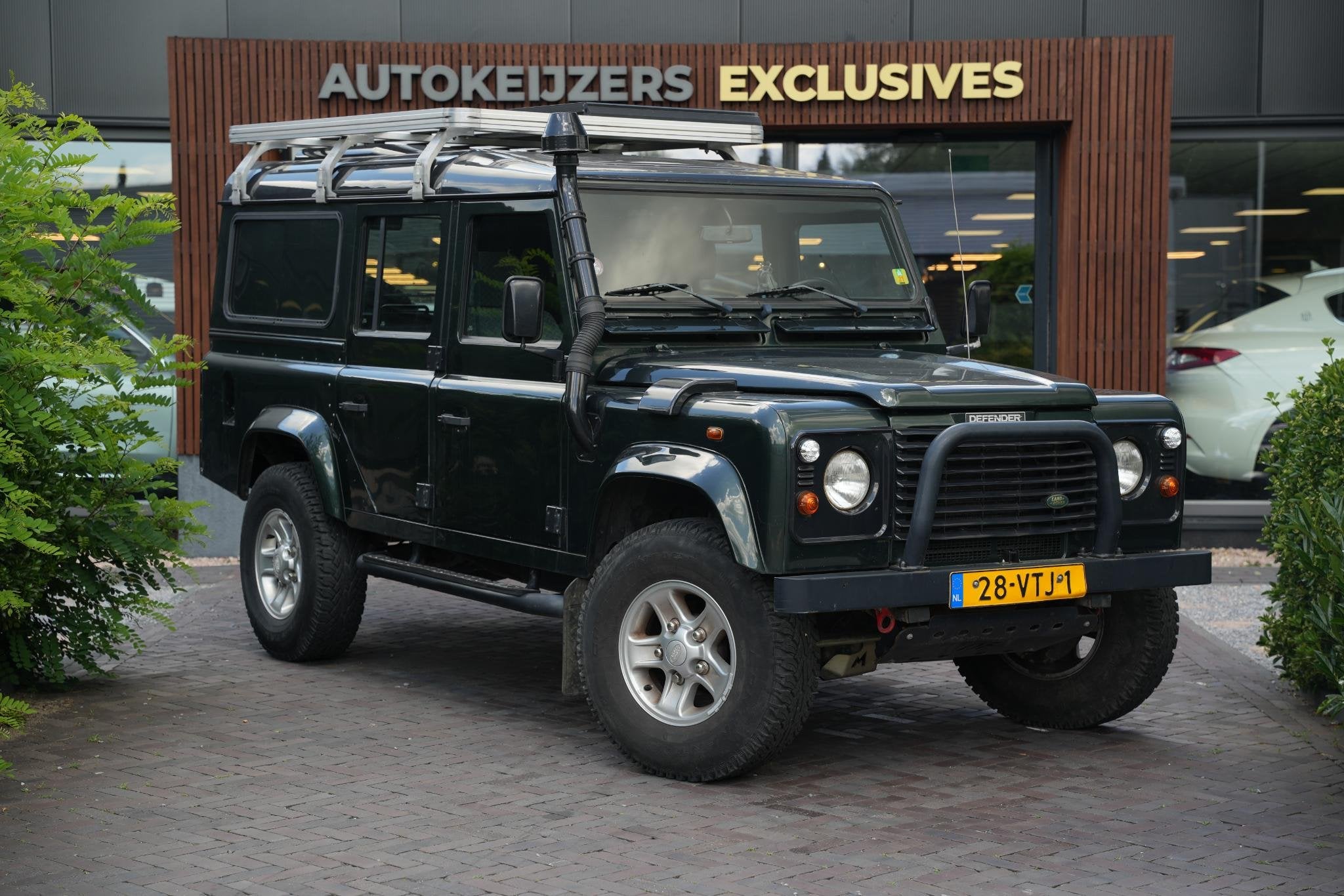 Land Rover Defender 2.5 Td5 SW 110" E, Auto's, Land Rover, Stof, Gebruikt, 2495 cc, 122 pk