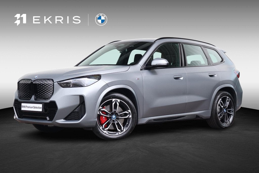 BMW iX1 eDrive20 67 kWh M Sport Edition | SoH 100% | Sportpa, Auto's, BMW, 514 km, Gebruikt, Metallic lak, Met garantie (alle)