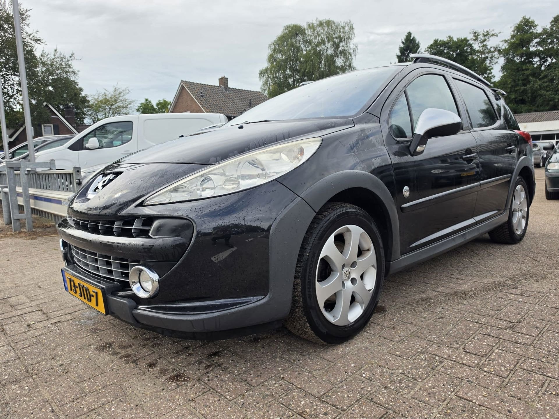 Peugeot 207 SW Outdoor 1.6 VTi Sublime, Auto's, Gebruikt, Zwart, 4 cilinders, Origineel Nederlands