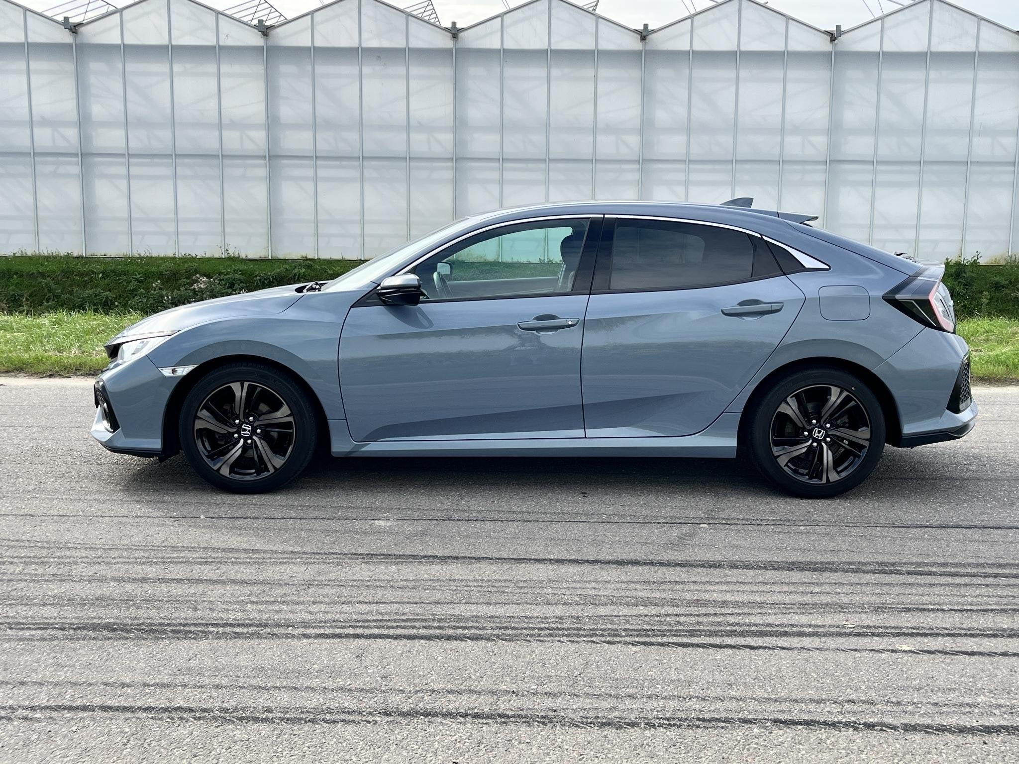 Honda Civic 1.0 i-VTEC Elegance, Auto's, Voorwielaandrijving, Automatische klimaatregeling, Stof, Gebruikt