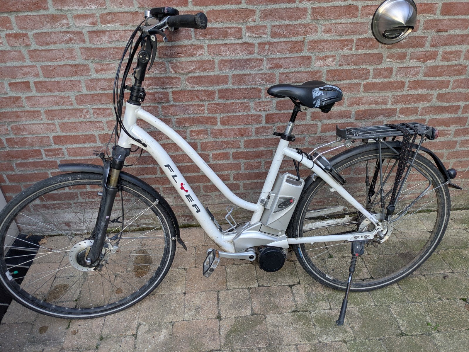 Flyer 27V E-bike met oplader Panasonic motor., Fietsen en Brommers, Ophalen, Gebruikt, Minder dan 30 km per accu, Overige merken